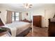 Comfortable bedroom with ample natural light, ceiling fan, and stylish wood-look flooring at 3881 Se 61St Pl, Ocala, FL 34480