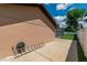 The exterior of the home has a concrete patio and a white fence surrounding the property at 3881 Se 61St Pl, Ocala, FL 34480
