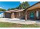 Close-up of front door, front porch, and brick accents on a single story home at 3881 Se 61St Pl, Ocala, FL 34480