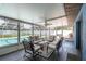 Screened-in patio, featuring comfortable seating, adjacent to a sparkling pool at 3881 Se 61St Pl, Ocala, FL 34480