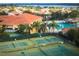 Aerial view of community tennis courts and community pool at 5009 Neptune Cir, Oxford, FL 34484