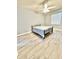 Cozy bedroom showcasing a metal frame bed, a ceiling fan and tile floors at 5009 Neptune Cir, Oxford, FL 34484
