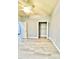 Bedroom with ceiling fan and walk-in closet with open doorway at 5009 Neptune Cir, Oxford, FL 34484