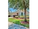 Attractive single-story home boasts manicured lawn and updated landscaping at 5009 Neptune Cir, Oxford, FL 34484