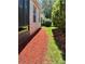 Landscaped exterior with colorful mulch and grass at 5009 Neptune Cir, Oxford, FL 34484