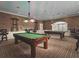 Community game room with billiard tables and lounge chairs at 5009 Neptune Cir, Oxford, FL 34484