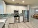 Well-equipped kitchen featuring stainless steel appliances and ample counter space at 5009 Neptune Cir, Oxford, FL 34484