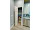 Pantry in kitchen featuring shelving and storage with a view of appliances at 5009 Neptune Cir, Oxford, FL 34484