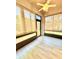 Sunroom features screened windows, ceiling fan, and exterior views at 5009 Neptune Cir, Oxford, FL 34484