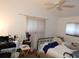 Basic bedroom with neutral colors, a ceiling fan, and lots of natural light, easily customizable to fit any style at 5391 Nw 19Th Pl, Ocala, FL 34482