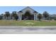 A grand exterior entrance with white pillars and manicured landscaping at 5391 Nw 19Th Pl, Ocala, FL 34482