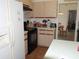 View of the kitchen with an oven, and a fridge at 5391 Nw 19Th Pl, Ocala, FL 34482