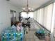 Enclosed sunroom with tile floor and lots of exercise equipment at 5391 Nw 19Th Pl, Ocala, FL 34482