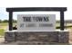 Entrance sign for The Towns at Laurel Commons community, featuring stone accents at 6559 Sw 81St Loop, Ocala, FL 34476