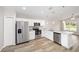 Well-equipped kitchen with stainless steel appliances, ample cabinets, and stylish countertops at 6638 Se 108Th Ln, Belleview, FL 34420