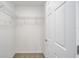 Walk-in closet with wire shelving and neutral carpeting at 6638 Se 108Th Ln, Belleview, FL 34420