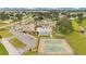 Aerial view showcases community amenities: pool, tennis courts, clubhouse, and ample parking at 8532 Sw 65Th Court Rd, Ocala, FL 34476