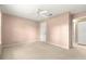 Bedroom with neutral carpet, ceiling fan, and a closet at 8532 Sw 65Th Court Rd, Ocala, FL 34476