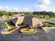 Clubhouse aerial view featuring lush landscaping and a convenient parking area at 8532 Sw 65Th Court Rd, Ocala, FL 34476