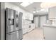 Open kitchen features granite countertops, stainless steel appliances, and white cabinetry at 8532 Sw 65Th Court Rd, Ocala, FL 34476
