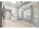 Bright eat-in kitchen features white cabinets, granite countertops, and stainless steel appliances at 8532 Sw 65Th Court Rd, Ocala, FL 34476