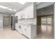 Updated kitchen with white cabinetry, stainless steel appliances, and granite countertops at 8532 Sw 65Th Court Rd, Ocala, FL 34476