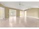 Spacious living room featuring tile flooring and multiple ceiling fans at 8532 Sw 65Th Court Rd, Ocala, FL 34476