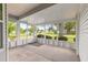 A sunny and spacious screened-in porch with a concrete floor at 8532 Sw 65Th Court Rd, Ocala, FL 34476
