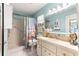 Bathroom featuring a shower, toilet, and vanity at 8710 Sw 91St St # E, Ocala, FL 34481