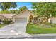 Charming one-story home with well-manicured lawn, beautiful landscaping, and attached two-car garage at 8710 Sw 91St St # E, Ocala, FL 34481