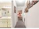 Hallway featuring carpet flooring leading to a bathroom and bedroom at 8710 Sw 91St St # E, Ocala, FL 34481
