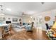 Open floor plan combining living room with breakfast bar, wood floors and lots of light at 8710 Sw 91St St # E, Ocala, FL 34481