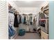 Spacious walk-in closet with shelves and hanging racks for ample storage at 8710 Sw 91St St # E, Ocala, FL 34481