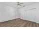 Bedroom with ceiling fan, wood-look flooring, and a closet at 8816 Sw 69Th Place Rd, Ocala, FL 34481