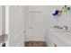 Bright laundry room with new appliances, door to exterior at 8816 Sw 69Th Place Rd, Ocala, FL 34481