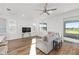 Well-lit living room features an open floor plan and direct access to the lanai at 8816 Sw 69Th Place Rd, Ocala, FL 34481