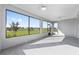 Large screened-in patio overlooking the landscaped backyard at 8816 Sw 69Th Place Rd, Ocala, FL 34481