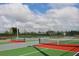 Community tennis courts with nets and fencing for recreational play at 8816 Sw 69Th Place Rd, Ocala, FL 34481