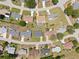 Aerial view of homes in a neighborhood, showcasing well-maintained lawns and landscaping at 8849 Sw 116Th Place Rd, Ocala, FL 34481