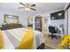 Well-lit bedroom featuring an attached office, desk, and neutral color palette at 8849 Sw 116Th Place Rd, Ocala, FL 34481