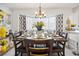 Charming dining room with modern decor, large windows, and an inviting table setting at 8849 Sw 116Th Place Rd, Ocala, FL 34481