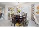 Beautiful dining room featuring a table set for six, modern decor, and ample natural light at 8849 Sw 116Th Place Rd, Ocala, FL 34481