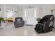 Open foyer with neutral tile flooring and view into living area, providing a seamless and welcoming entrance at 8849 Sw 116Th Place Rd, Ocala, FL 34481