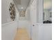 Clean hallway with white trim, neutral walls, and modern lighting at 8849 Sw 116Th Place Rd, Ocala, FL 34481