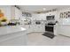 Modern kitchen featuring white cabinets, stainless steel appliances, and ample counter space at 8849 Sw 116Th Place Rd, Ocala, FL 34481