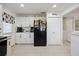 Spacious kitchen with white cabinets, modern appliances, and plenty of counter space at 8849 Sw 116Th Place Rd, Ocala, FL 34481