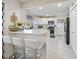 Bright kitchen with white cabinets, subway tile backsplash, and stainless steel appliances at 8849 Sw 116Th Place Rd, Ocala, FL 34481