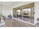 Spacious patio with modern tile flooring and sliding glass doors to the outdoors at 8849 Sw 116Th Place Rd, Ocala, FL 34481