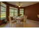 Cozy breakfast nook featuring a bright dining table and beautiful window views at 8926 Sw 192Nd Court Rd, Dunnellon, FL 34432