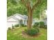 Charming light blue house, with manicured lawn, beautiful landscaping, and an attached two-car garage at 8926 Sw 192Nd Court Rd, Dunnellon, FL 34432